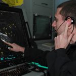 091101-N-8960W-009
GULF OF OMAN (Nov. 1, 2009) Air Traffic Controller 3rd Class Elliott Young, assigned to the aircraft carrier USS Nimitz (CVN 68), performs a traffic call to departing aircraft. The Nimitz Carrier Strike Group is on a routine deployment to the region. (U.S. Navy photo by Mass Communication Specialist Seaman Apprentice Robert Winn/ Released)