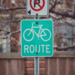 A green bicycle sign post.