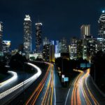 A time lapse photo of traffic in the city at night.
